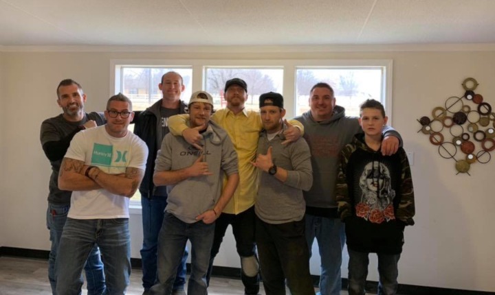 Open Vessels volunteers building a wheelchair ramp together