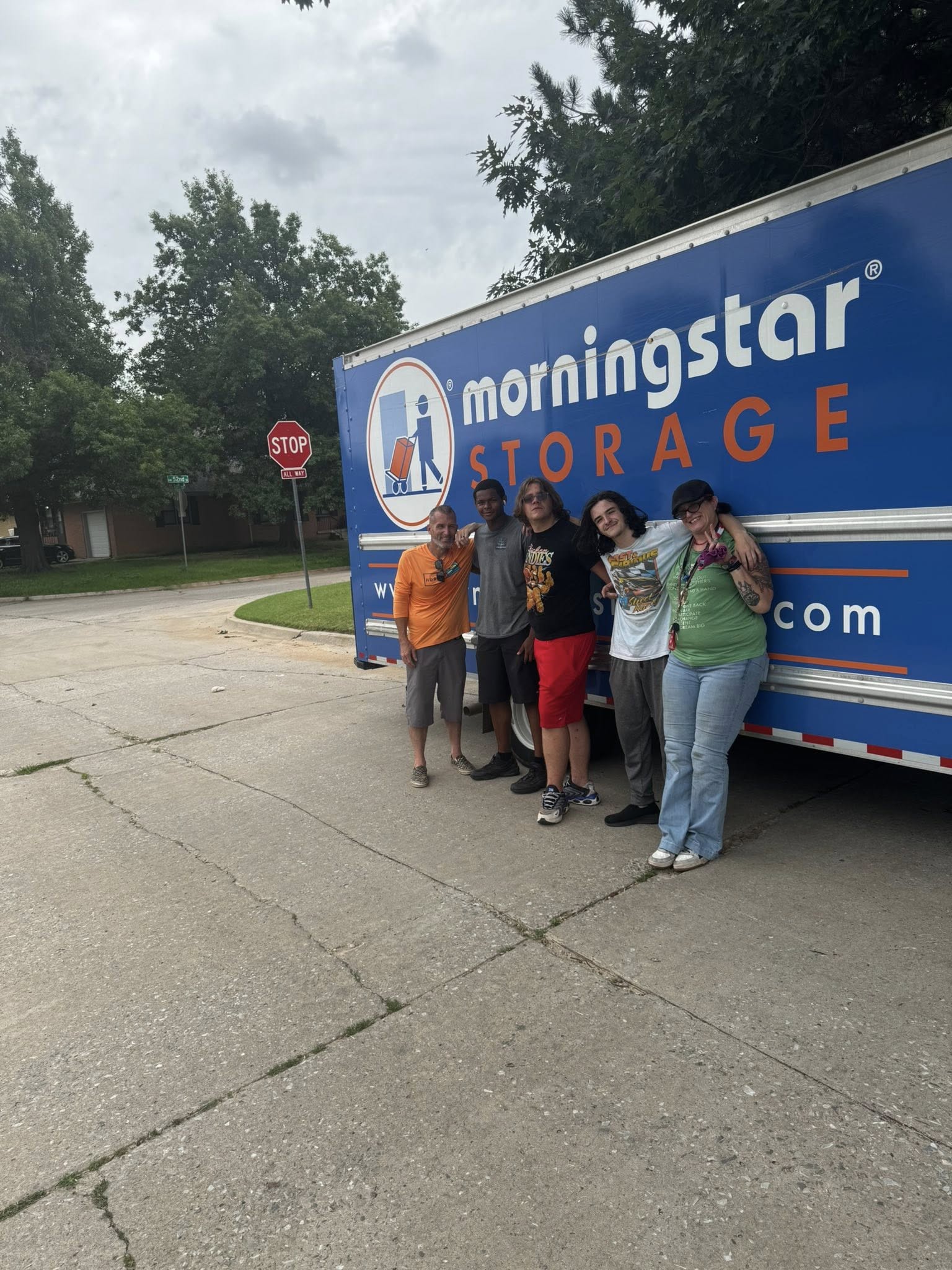 Volunteers standing in front of moving truck
