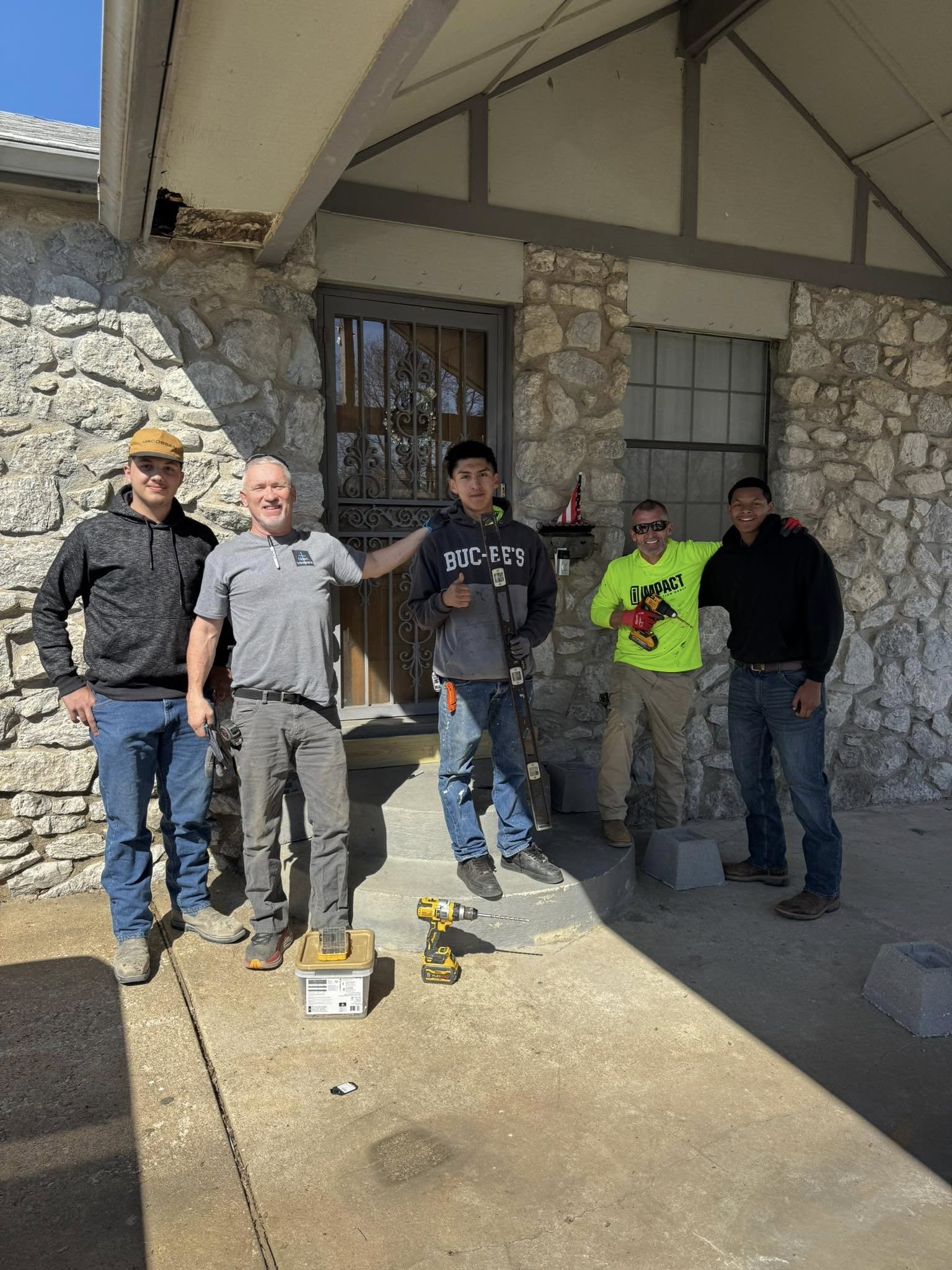 Happy volunteers and family group selfie